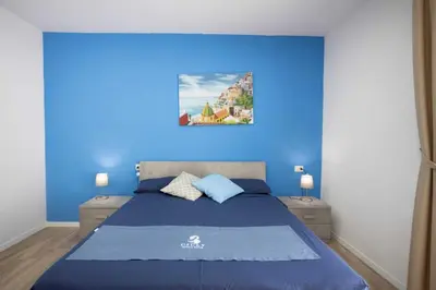 Letto o letti in una camera di GIULY SUITES & ROOMS