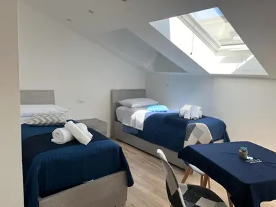 Letto o letti in una camera di GIULY SUITES & ROOMS