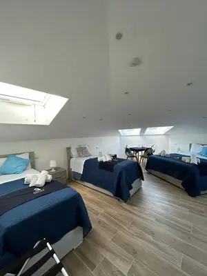 Letto o letti in una camera di GIULY SUITES & ROOMS