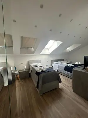 Letto o letti in una camera di GIULY SUITES & ROOMS