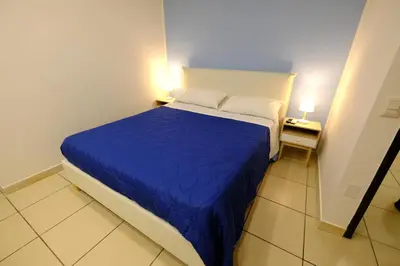 Letto o letti in una camera di Donna Elena B&B