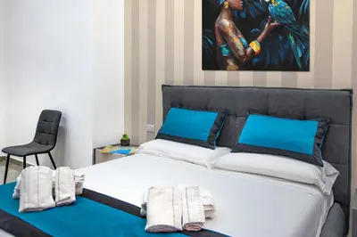 Letto o letti in una camera di Irooms Garibaldi
