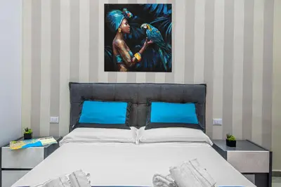 Letto o letti in una camera di Irooms Garibaldi