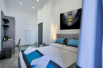 Letto o letti in una camera di Irooms Garibaldi