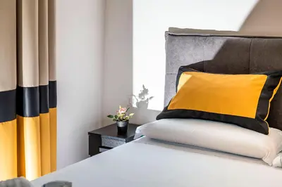 Letto o letti in una camera di Irooms Garibaldi