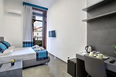 Letto o letti in una camera di Irooms Garibaldi