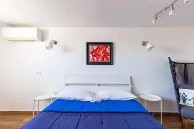 Letto o letti in una camera di Viewsuvio Terrace at historical center by Napoliapartments