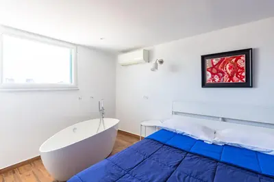Letto o letti in una camera di Viewsuvio Terrace at historical center by Napoliapartments