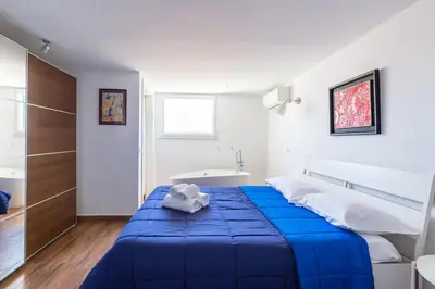 Letto o letti in una camera di Viewsuvio Terrace at historical center by Napoliapartments