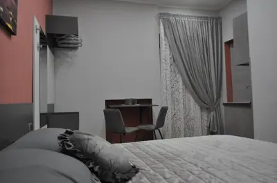 Letto o letti in una camera di HSUITE