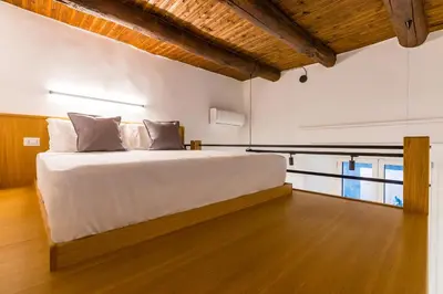 Letto o letti in una camera di Napoli Street Art Rooms by Wonderful Italy