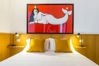 Letto o letti in una camera di Napoli Street Art Rooms by Wonderful Italy