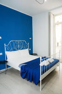 Letto o letti in una camera di Vulcania Rooms