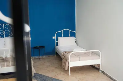 Letto o letti in una camera di Vulcania Rooms