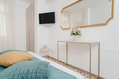 Letto o letti in una camera di Il Cortile by Vista Napoli