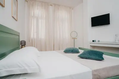 Letto o letti in una camera di Il Cortile by Vista Napoli