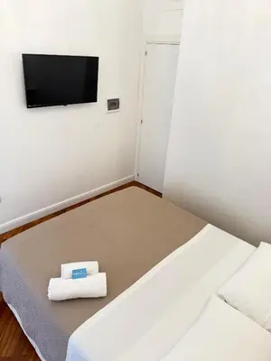 Letto o letti in una camera di La Canzonetta Affittacamere