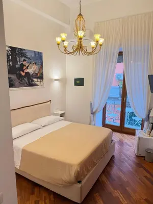 Letto o letti in una camera di La Canzonetta Affittacamere