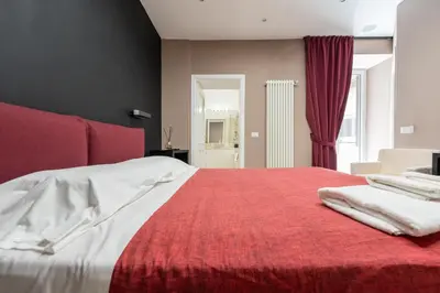 Letto o letti in una camera di Casa Movie by Ospitalia Napoli