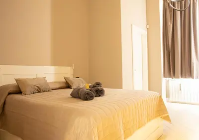 Letto o letti in una camera di Amedeo Suite - Il salotto di Napoli