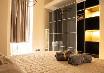 Letto o letti in una camera di Amedeo Suite - Il salotto di Napoli