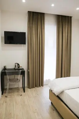 Letto o letti in una camera di AROMA Apartment and b&b, Maschio Angioino