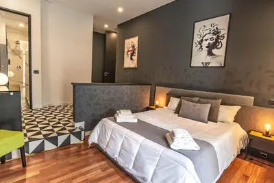 Letto o letti in una camera di Gram Suites