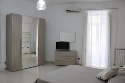 Letto o letti in una camera di O CORE E NAPULE