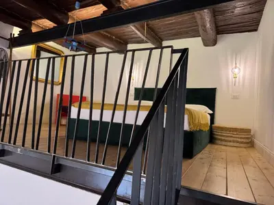 Letto o letti in una camera di Profumo Storico