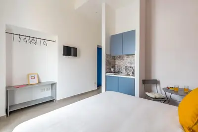 Letto o letti in una camera di Maria's Bright Flats at the Cathedral by Wonderful Italy