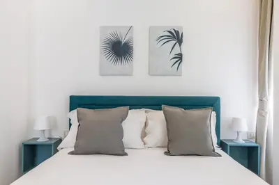 Letto o letti in una camera di Maria's Bright Flats at the Cathedral by Wonderful Italy