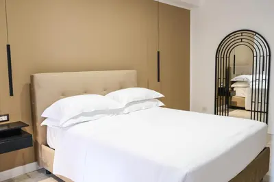 Letto o letti in una camera di Aroma Apartment, Maschio Angioino-Porto Di Napoli