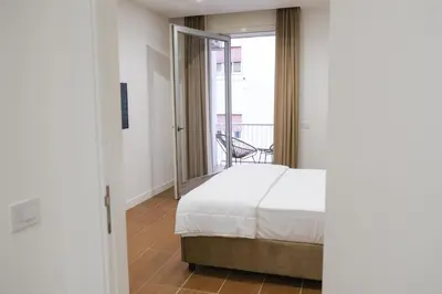 Letto o letti in una camera di Aroma Apartment, Maschio Angioino-Porto Di Napoli