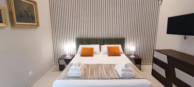 Letto o letti in una camera di Astrea