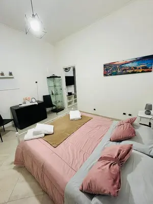 Letto o letti in una camera di La coccola napoletana