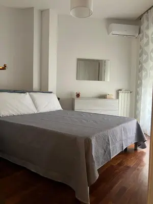 Letto o letti in una camera di Casa Caprioli Napoli