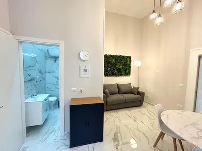 Area soggiorno di Naples Apartment Plebiscito