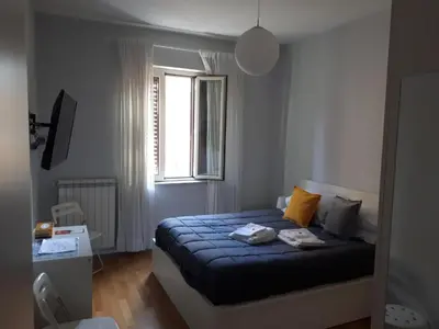 Letto o letti in una camera di Una Napoli FELICE
