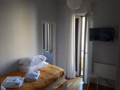 Letto o letti in una camera di Una Napoli FELICE