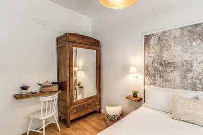 Letto o letti in una camera di Annamaria Rooms
