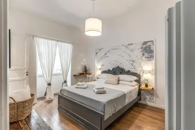 Letto o letti in una camera di Annamaria Rooms