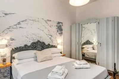 Letto o letti in una camera di Annamaria Rooms