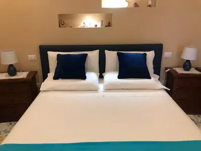 Letto o letti in una camera di Casa Garzilli