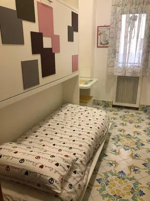 Letto o letti in una camera di Casa Garzilli
