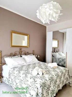 Letto o letti in una camera di Olivella21 Luxury Apartment Montesanto