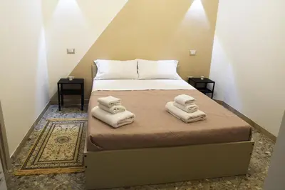 Letto o letti in una camera di Napul’è