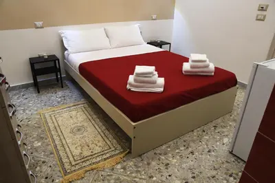 Letto o letti in una camera di Napul’è