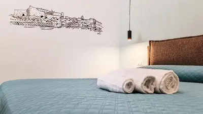Letto o letti in una camera di Casa Calù Castel Sant'Elmo
