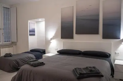 Letto o letti in una camera di Dietro al Plebiscito luxury suite