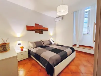 Letto o letti in una camera di Chiaia House Vetriera